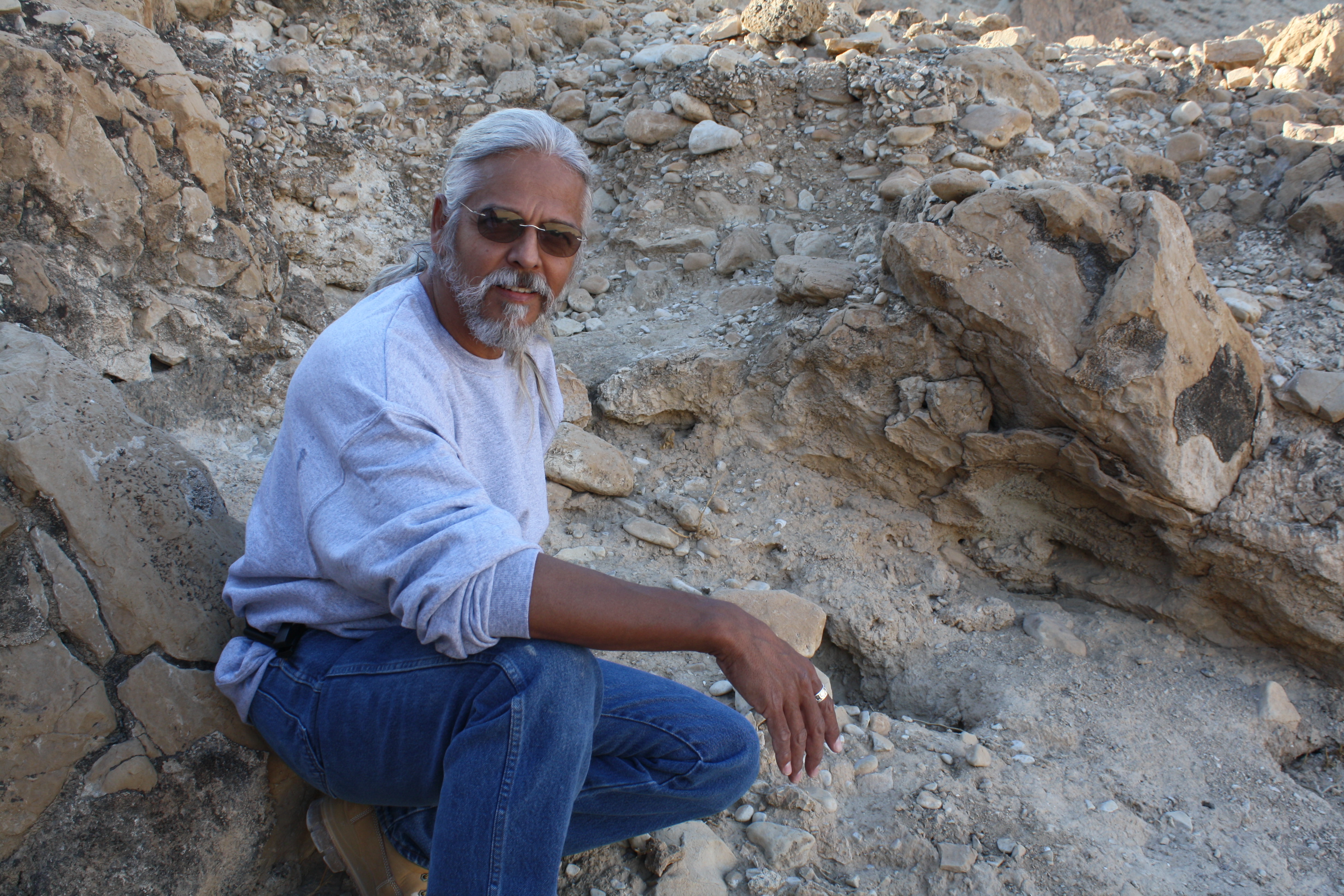 Jim sitting on rock